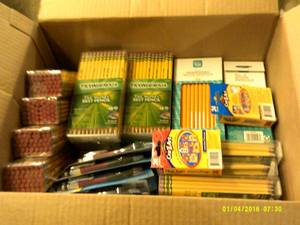 box with pencils and mechanical pen...