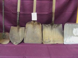 Various sizes of shovels with woode...