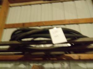 Black Garden hose estimate 25-50 ft...
