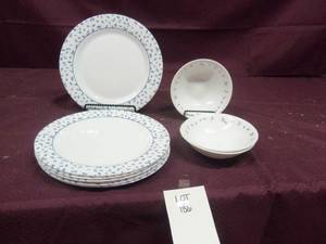 Antique white bowls and plates with...