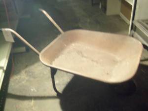 Vintage wheel barrel with a solid w...