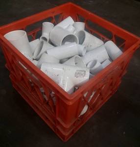 lot 20 image: Vintage Abbott milk crate with pvc connectors