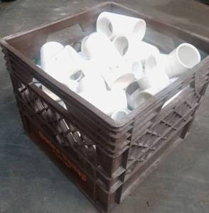 lot 23 image: Vintage Swiss Valley milk crate with pvc connectors