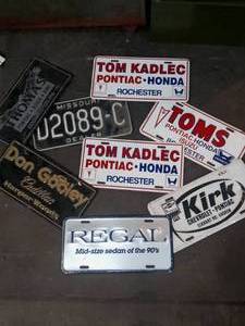 lot 24 image: Vintage dealership plates