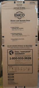 lot 4 image: EMCO 30 in. x 78 in. 100 Series White Self-Storing Storm Door