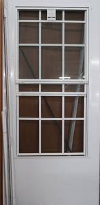 lot 11 image: EMCO 36 in. x 80 in. 300 Series White Universal Colonial Triple-Track Aluminum Storm Door
