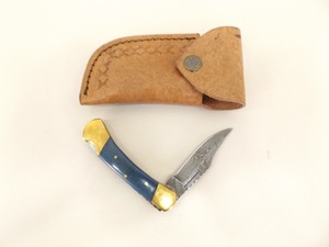 lot 32 image: NEW Unused Damascus Steel Folding Knife in Leather Case