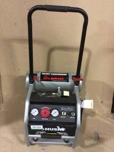 lot 21 image: 4.5 Gal. Portable Electric-Powered Silent Air Compressor by Husky open box customer return see pictures