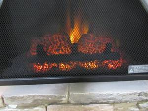 lot 238 image: Home Decorators Collection Highland 40 in. Faux Stone Mantel Electric Fireplace in Tan 102907