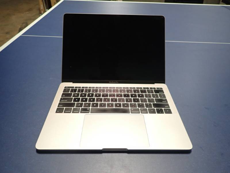 lot 1 image: Apple MacBookPro 13,1 A1708  I5-6360U CPU  2.00GHZ  8 GB DDR3 MEM  13.3 screen (includes OS)(no charger) Unit has damaged pixels in screen, will need new screen.