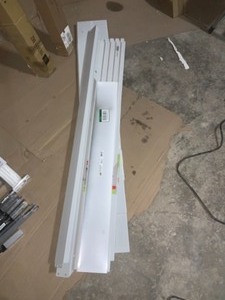 lot 18 image: ASSORTED rubbermaid fasttrack rails and Garage wall panels for tools to hang on Most New, Some Open Box see pics