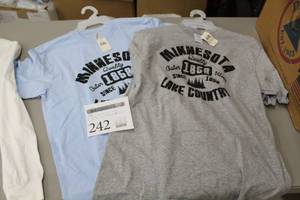 lot 242 image: Lot of (4) Minnesota 1858 Lake Country 1858 T-Shirt (new) - Delta Pro Weight Large Grey (x2), Alstyle Large Baby Blue (x2)