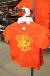 lot 304 image: Lot of (9) Fruit of the Loom Heavy Cotton T-Shirt Youth Small 6-8 Flame Resistent 100% Cotton Orange with Minnesota Outfitters Logo (new)