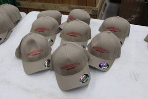 lot 373 image: Lot of (8) Flex Fit Baseball Cap SmallMedium 98% Cotton 2% Spandex Tan with Minnesota Logo (new)