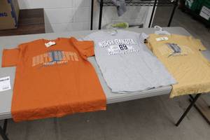 lot 441 image: Lot of (3) T-Shirt Small (x2), Medium (x1) Grey,Tan,Orange with North Dakota Logo (new)