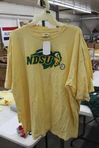 lot 429 image: Lot of (4) Comfort Colors T-Shirt 2X-Large (x3), 3X-Large (x1) 100% Cotton Yellow with NDSU Bison North Dakota State University Logo (new)