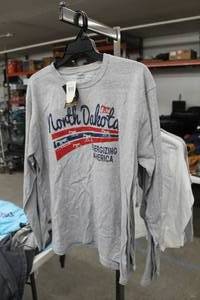 lot 450 image: Lot of (2) Cabelas Long Sleeve T-Shirt X-Large Grey with North Dakota Energizing America Logo (new)