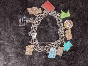 lot 270 image: Sterling Silver State Charm Bracelet - 10 States