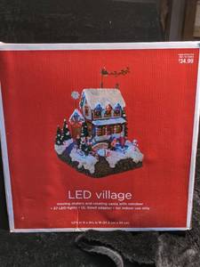lot 145 image: LED Village Moving Skaters and Rotating Santa with Reindeer