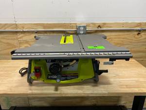 lot 103 image: RYOBI 15 Amp 10 in. Expanded Capacity Table Saw