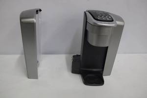 lot 25 image: Keurig K-Elite Coffee Maker, Single Serve K-Cup Pod Coffee Brewer, With Iced Coffee Capability, Brushed Silver.