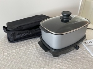 lot 123 image: West Bend Housewares 5-6 Quart Slow Cooker with Travel Case