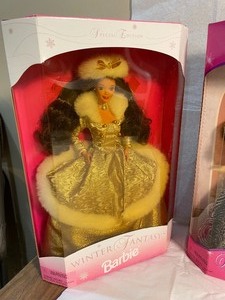 lot 11 image: Three Special Edition Holiday Barbies