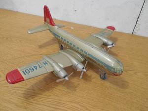 lot 130 image: 1950s Northwest Airlines Friction Tin Litho Plane