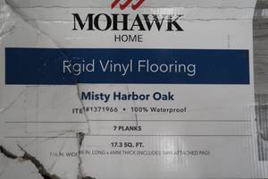 lot 31 image: Mohawk Home Misty Harbor Oak Waterproof Rigid 5mm Thick Luxury Vinyl Plank Flooring (7-12 W x 48 L)  1mm Attached Pad Included-  138.4 sq. ft.