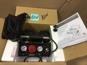 lot 6 image: 1 Gal. Portable Electric-Powered Silent Air Compressor by Husky Open Box Customer Returns See pictures.