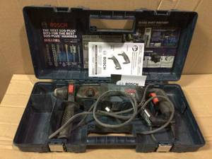 lot 10 image: Bulldog Xtreme 8 Amp 1 in. Corded Variable Speed SDS-Plus ConcreteMasonry Rotary Hammer Drill with Carrying Case by Bosch USED Open Box Customer Returns See pictures.