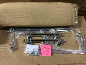 lot 28 image: 5-Bar Wall-Mounted Towel Rack in Polished Chrome by Delta Open Box Customer Returns See pictures.