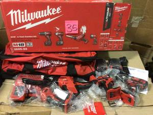 lot 35 image: M18 18-Volt Lithium-Ion Cordless Combo Tool Kit (4-Tool) w(2) 3.0Ah Batteries, (1) Charger, (1) Tool Bag by Milwaukee Open Box Customer Returns See pictures.