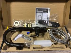 lot 77 image: Marchand Single Handle Pull-Down Sprayer Kitchen Faucet in Legacy Bronze by American Standard Open Box Customer Returns See pictures.