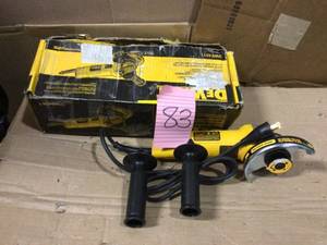 lot 83 image: 7 Amp 4-12 in. Small Angle Grinder with 1-Touch Guard by DEWALT Open Box Customer Returns See pictures.