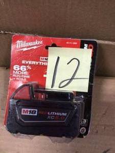 lot 12 image: M18 18-Volt Lithium-Ion XC Extended Capacity 5.0Ah Battery Pack by Milwaukee Customer returns see pictures