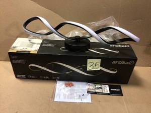 lot 35 image: Swirl 27 in. Black LED Vanity Light Bar by ARTIKA Customer returns see pictures
