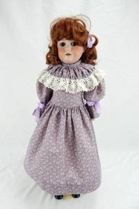 lot 72 image: Antique German Bisque Cork Stuffed Armand Marseille Floradora Doll With Stand and Display Case