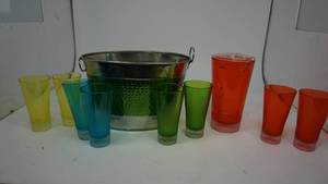 lot 25 image: Green & Silver Metal Ice Tub  Red Plastic Pitcher with 8 Glasses