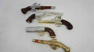 lot 35 image: Vintage AVON GunPistol Decanters