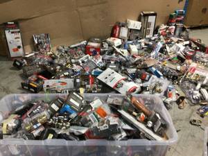 lot 7 image: Gaylord full of assorted door knobs and hardware customer returns open boxes