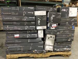lot 11 image: Pallet with assorted Glacier Bay Faucets open boxes and customer returns