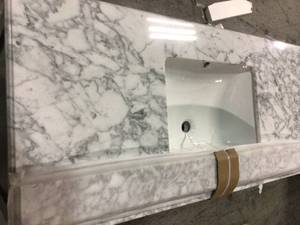 lot 30 image: Home Decorators Sturgess 49 in. W x 22 in. D Bath Vanity in Navy Blue with Marble Vanity Top in Carrara White with White Basin see pictures