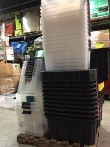 Pallet with assorted plastic storage bins some missing tops see pictures