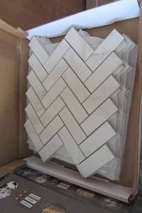lot 25 image: Avante Bianco 12 in. x 15 in. x 9mm Porcelain Herringbone Mosaic Tile (5.65 sqFt)