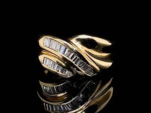 lot 42 image: High Quality 14kp Gold Ring with Waves of Beautiful Diamond Baguettes