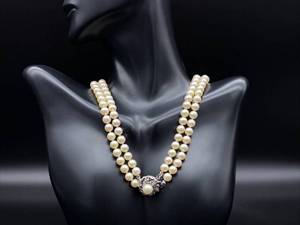 lot 63 image: Lustrous Double Strand Pearl Necklace with Fleurette and Pearl Silver Clasp
