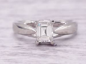lot 6 image: Gorgeous .48 Carat Emerald Cut Diamond Solitaire Engagement Ring in Platinum $3,524 Retail