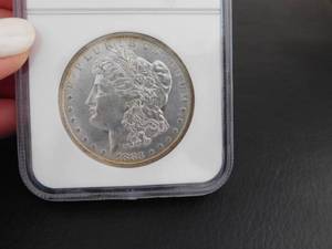 1883-O Morgan Silver Dollar NGC MS64 NGC Price Guide is $85