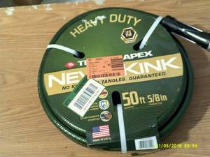lot 15 image: Heavy duty never kink 50ft garden h...